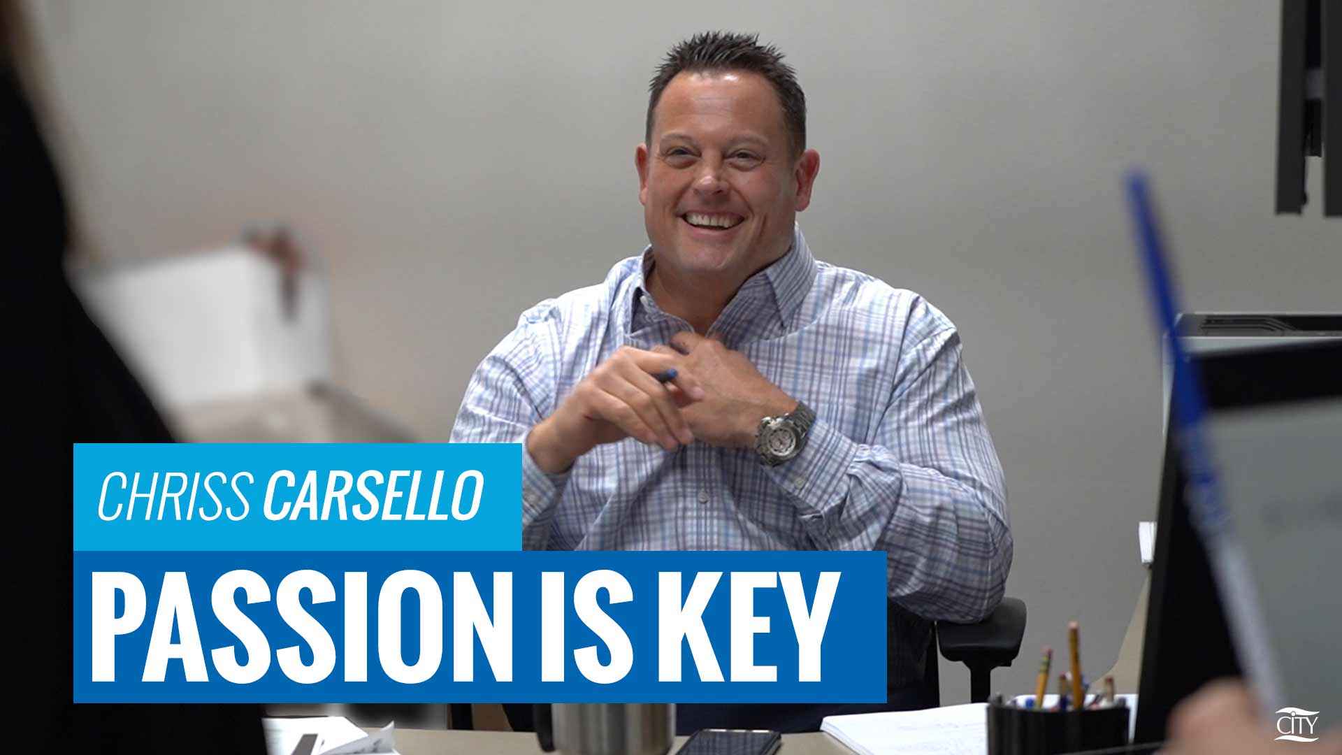 CITY Sales Manager, Chriss Carsello, smiling for a picture during an interview for a passion is key graphic.