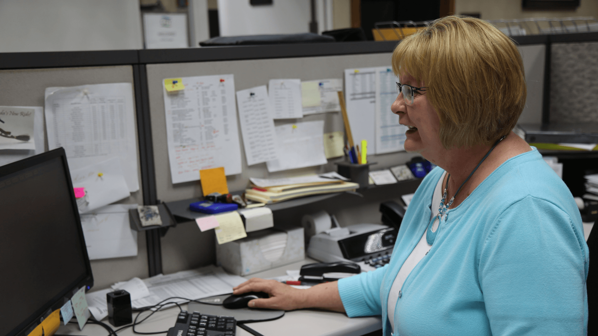 Rhonda Kerns, CITY Laundering's Billing Specialist, working at CITY Laundering's Oelwein office. 